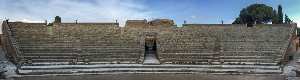 Low angle view of woman standing on steps