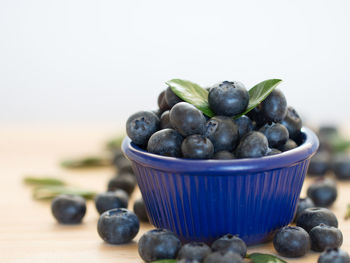 Close-up of fruits in bowl on table