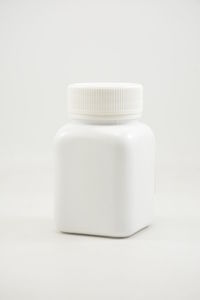 Close-up of wineglass on white background