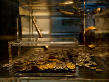 Coins in glass container at museum