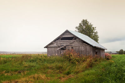 House on field against sky