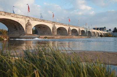 Bridge over river against sky