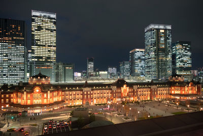 Illuminated buildings in city at night