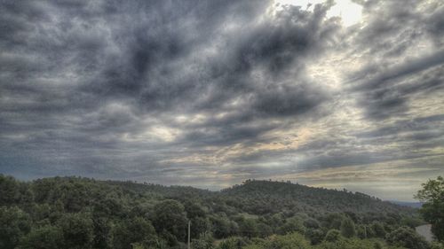 Scenic view of landscape against cloudy sky