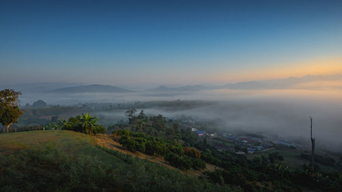 Scenic view of landscape against sky during sunset