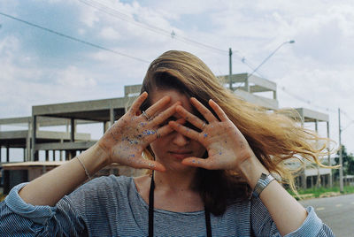 Woman looking in front of building