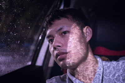 Close-up of man in car