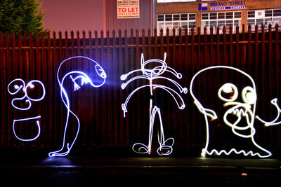 Illuminated lights in city at night