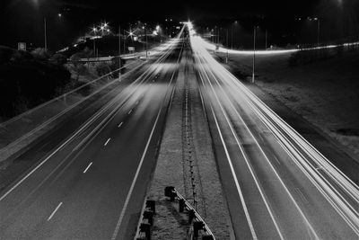 High angle view of light trails on road at night