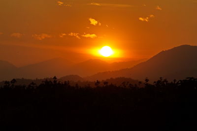 Scenic view of mountains at sunset