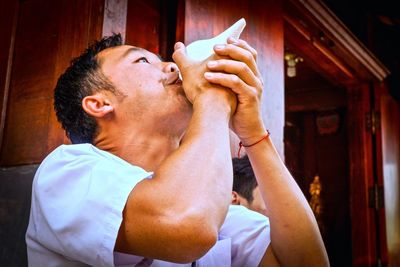 Close-up of man drinking