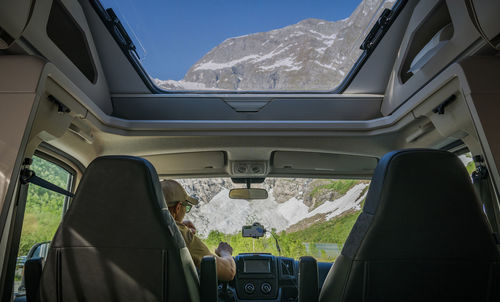 Low section of man in car