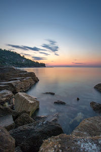 Scenic view of sea against sky at sunset