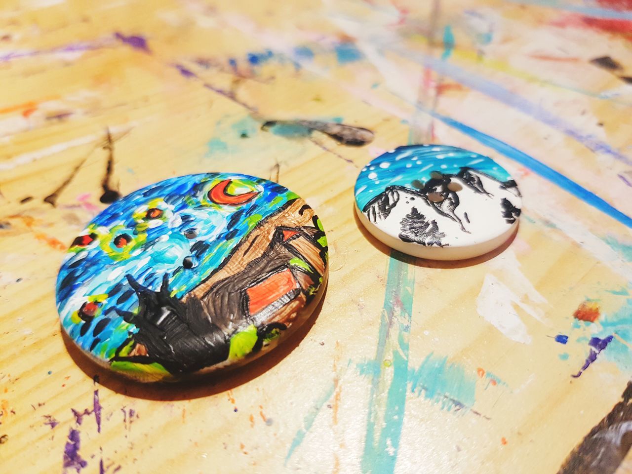 multi colored, still life, table, close-up, art and craft, creativity, no people, indoors, pattern, wood - material, focus on foreground, craft, floral pattern, high angle view, design, shape, selective focus, day, container, flooring