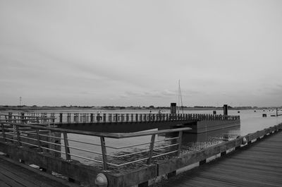 Pier over sea against sky