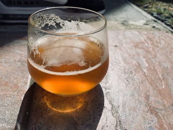 Close-up of beer glass on table