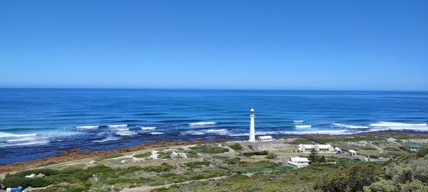 Scenic view of sea against clear blue sky