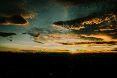 Scenic view of dramatic sky during sunset