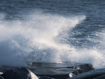 Sea waves splashing on rocks