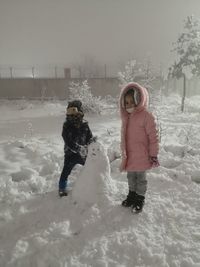 Full length of woman on field during winter