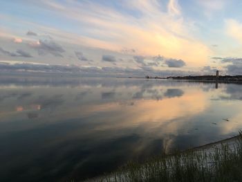 Scenic view of lake against sky during sunset