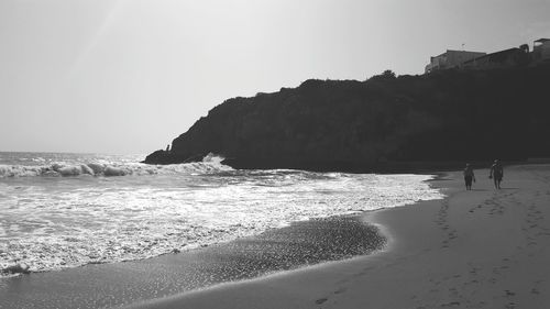 Scenic view of beach against clear sky