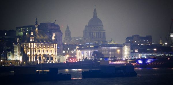Illuminated city during winter at night