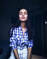 Beautiful woman with eyes closed at home