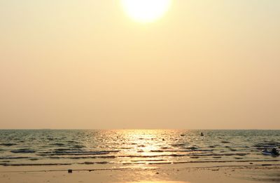 Scenic view of sea against clear sky during sunset