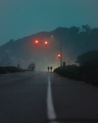 Street lights on road at night