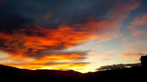 Low angle view of dramatic sky during sunset