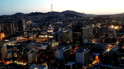 High angle view of illuminated city buildings at night