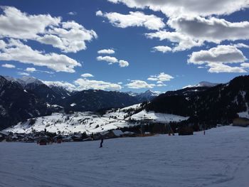 Scenic view of snowcapped mountains against sky