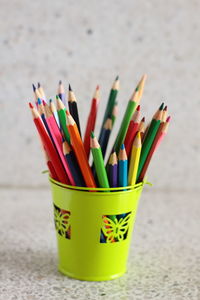Close-up of multi colored pencils on table