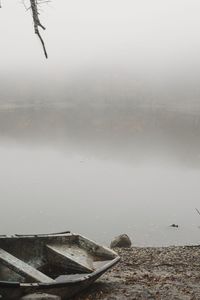 Scenic view of lake against sky during winter