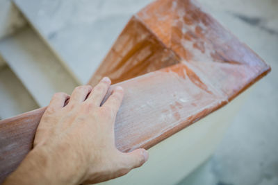 Close-up of hand on railing