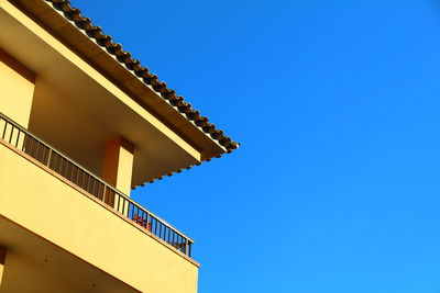 Low angle view of built structure against blue sky