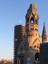 Low angle view of building against clear blue sky