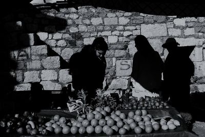 Group of people for sale at market stall