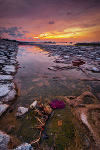 Scenic view of sea against sky at sunset