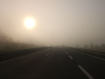 Highway against sky during sunset