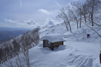 Scenic view of snow covered mountains against sky