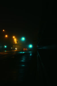 Car on illuminated street at night