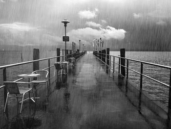 Pier over lake during rainy season