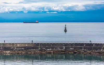 Scenic view of sea against cloudy sky