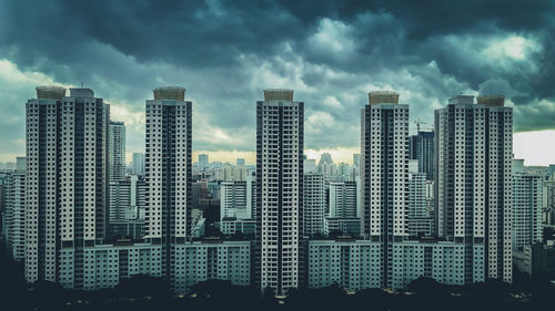 Modern buildings in city against sky