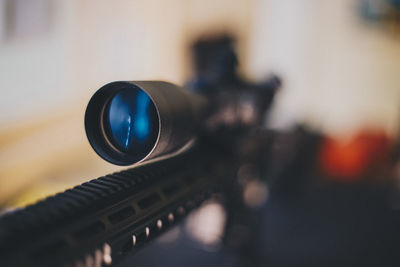 Close-up of sniper on table