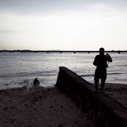 Full length of woman standing on beach