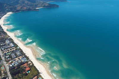 High angle view of sea and city