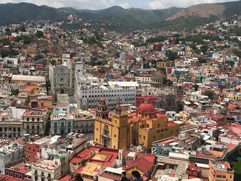 High angle view of townscape against mountains